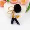ECARLA brelok do kluczy LITERKA K Czarno Złota z pomponem BRL342K 
