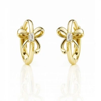 ECARLA kolczyki ze stali szlachetnej platerowanej złotem KOŁO Z KOKARDKĄ KST3523